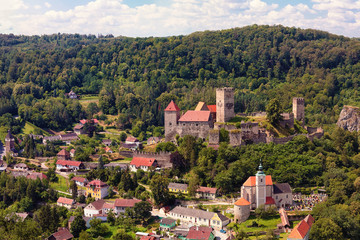 Fototapeta na wymiar Burg Hardegg - a castle in Lower Austria, Austria. Woodland around, summer day with blue sky with white clouds.