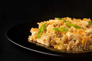 Chinese rice with herbs, carrots, corn and chicken
