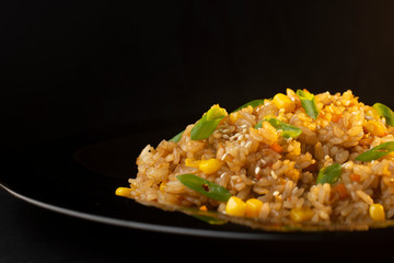 Chinese rice with green onions, carrots and corn