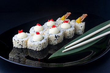 Japanese Sushi Rolls with Cream Cheese , flying fish roe and sesame seeds