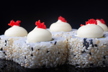 Japanese Sushi Rolls with Cream Cheese , flying fish roe and sesame seeds