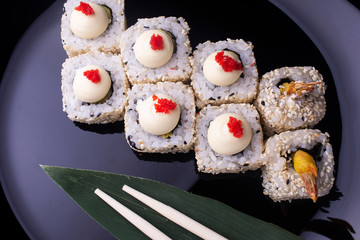Japanese Sushi Rolls with Cream Cheese , flying fish roe and sesame seeds