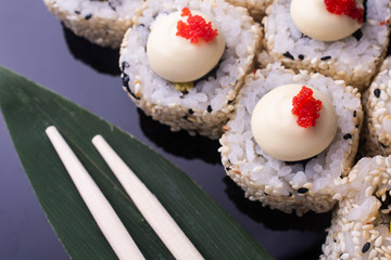 Japanese Sushi Rolls with Cream Cheese , flying fish roe and sesame seeds