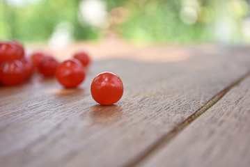 Ripe sweet cherries on a wooden table. Red berries.