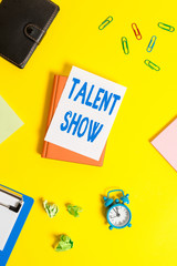 Text sign showing Talent Show. Business photo showcasing Competition of entertainers show casting their perforanalysisces Pile of empty papers with copy space on the table