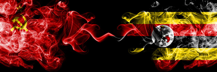 Communist vs Uganda, Ugandan abstract smoky mystic flags placed side by side. Thick colored silky smoke flags of Communism and Uganda, Ugandan