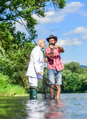 Successful catch. Elegant bearded man and brutal hipster fishing. Hobby and recreation. Family day. Fishing team. Relax in natural environment. Summer vacation. Friends fishing. Perfect weekend