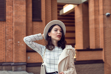 Stylish young girl in an autumn look