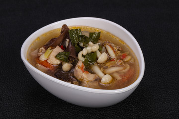 Thai style soup with meat and mushrooms