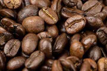 Roasted coffee beans background, Close Up mixture of different kinds of coffee beans.