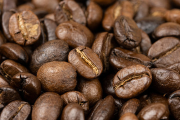Roasted coffee beans background, Close Up mixture of different kinds of coffee beans.