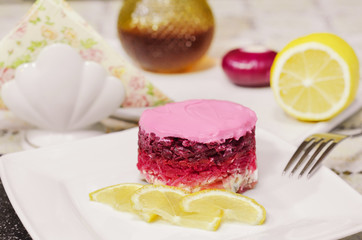 Vegetable salad with mayonnaise, lemon wedges. Selective focus