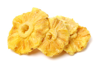 Slices of dried pineapple isolated on white background.