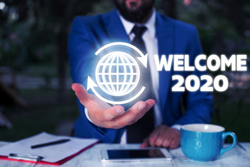Conceptual hand writing showing Welcome 2020. Concept meaning New Year Celebration Motivation to...