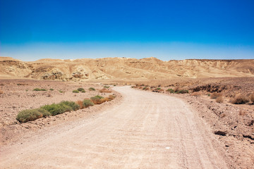 desert wallpaper landscape wilderness waste land dry scenic view with curved road foreground and bare mountain ridge background 