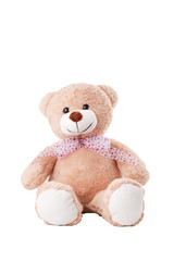 Lovely brown cloth bear sitting down on white background. Lovely, adorable toy with spot neck bow tie
