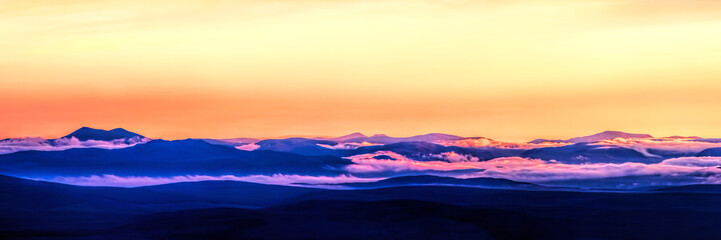 Fototapeta premium Sunset on the West Coast of Scotland from the summit of Ben Horn in Sutherland