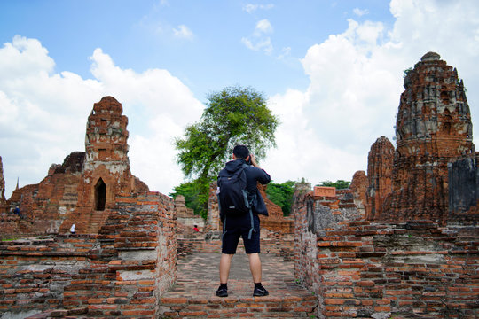 Tourists taking pictures of historic sites in Asian countries