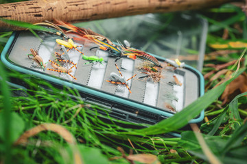 Box with flies for fishing. Fly fishing.