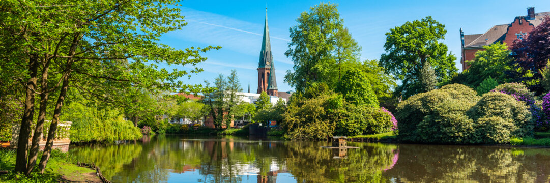 View of the pond and St. Lamberti Church of Oldenburg, Germany.