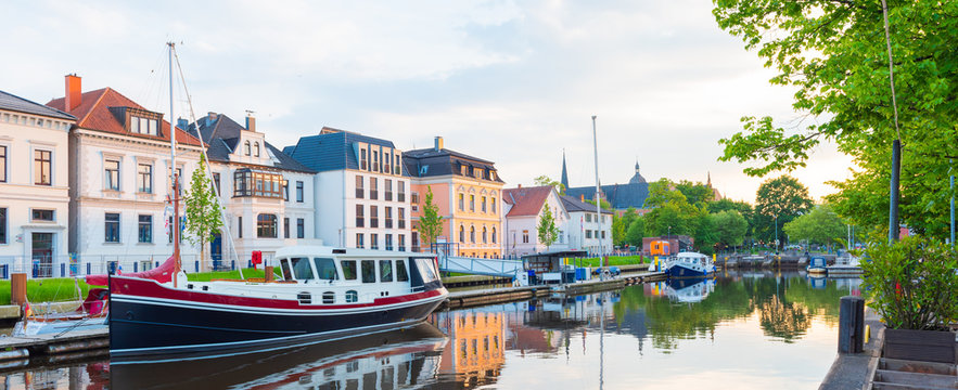 Boats drop anchor in a haven, Oldenburg, Germany.