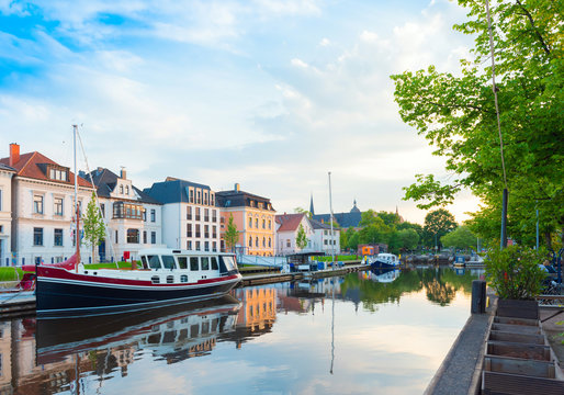 Boats drop anchor in a haven, Oldenburg, Germany.