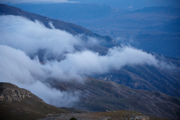 Image of foggy mountain area at sunset