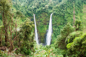 Beautiful waterfall in the green deep forest