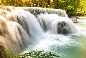 Fototapeta na wymiar Beautiful waterfall in the green deep forest