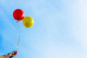 Below view of colorful balloons against the sky.