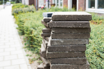 street road reconstruction, heap grey tiles for paving