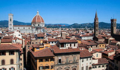 Fototapeta na wymiar Spectacular view of the roofs of Florence and its cathedral from the Tower of Palazzo Vecchio