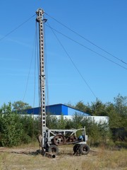 Mobile drilling rig for drilling a water well in working condition.