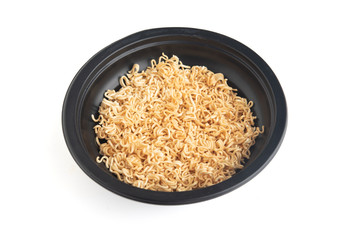 Instant noodles in a black Bowl. Isolated on white
