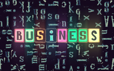 The word Business as neon glowing unique typeset symbols, luminous letters for poster, production, enterprise, industry, company
