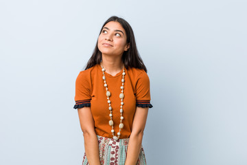 Young arab woman dreaming of achieving goals and purposes