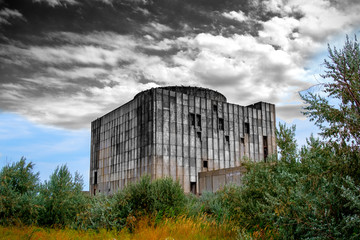 Abandoned nuclear power station. The concept of color and black-and-white image.