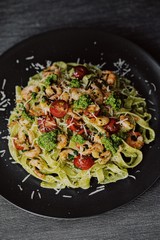 pasta tagliatelle with pesto, garlic shrimps and cherry
