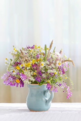 Bouquet of wild flowers on the table.