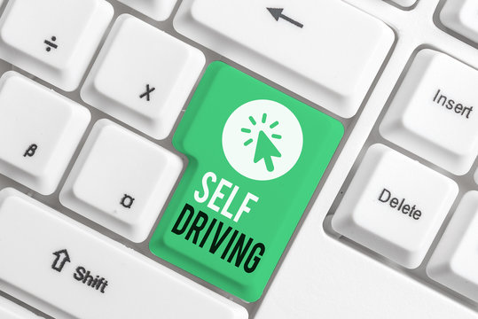 Writing note showing Self Driving. Business concept for Autonomous vehicle Ability to navigate without huanalysis input White pc keyboard with note paper above the white background