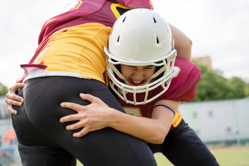 Photo of two female rugby athletes on playground
