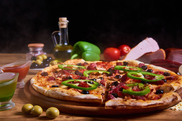 Pizza margarita with tomato sauce, fresh mozzarella, parmesan on the wooden rusty background. Hot big pepperoni pizza, tasty pizza composition