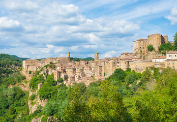 Obraz premium Sorano (Italy) - An ancient medieval hill town hanging from a tuff stone in province of Grosseto, Tuscany region, know as the Little Matera.
