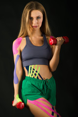 Power dumbbells training, kinesio tape