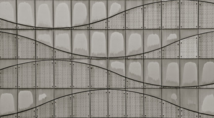 Fototapeta na wymiar Modern panelled wall with wave pattern