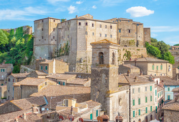 Fototapeta na wymiar Sorano (Italy) - An ancient medieval hill town hanging from a tuff stone in province of Grosseto, Tuscany region, know as the Little Matera.