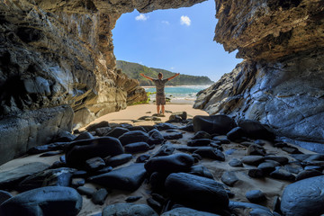 Whites Beach Cave with person, South of Byron Bay, NSW, Australia