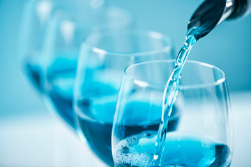 Blue Wine Pouring