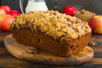 Sweet apple and walnut pie on wooden rustic table