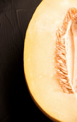 half melon on a black background